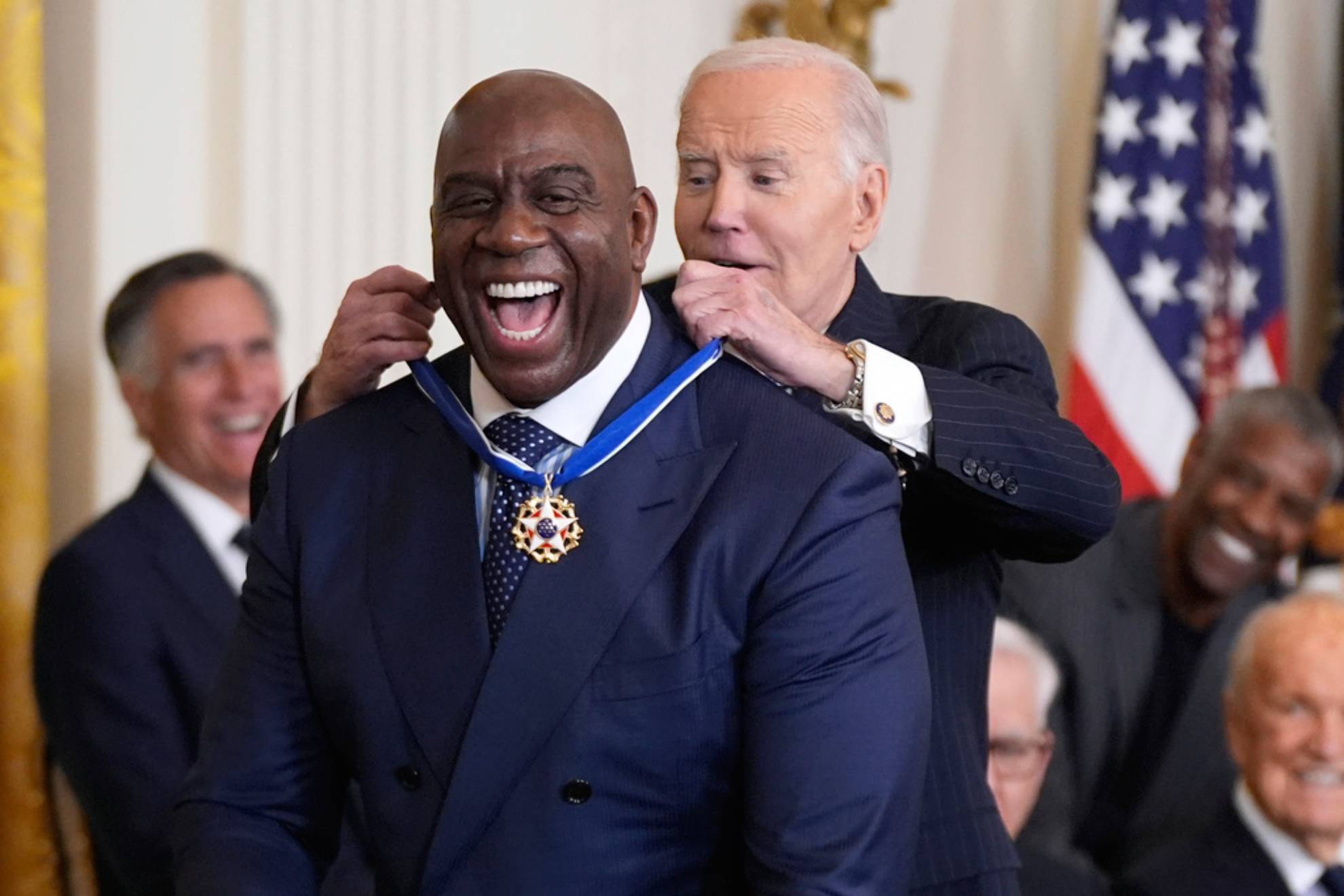 President Joe Biden, right, presents the Presidential Medal of Freedom, the Nations highest civilian honor, to Earvin Magic Johnson in the East Room of the White House /