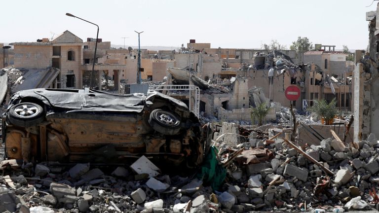 Rubble along a road in downtown Raqqa