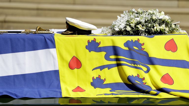 The Duke of Edinburgh's coffin, covered with His Royal Highness's Personal Standard on The Land Rover Defender outside St George's Chapel, Windsor Castle, Berkshire, during the funeral of the Duke of Edinburgh. Picture date: Saturday April 17, 2021.