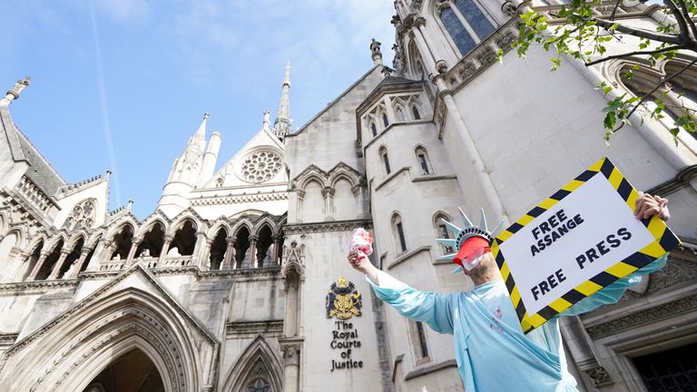 A protester is pictured outside Assange's hearing