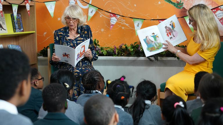 The Duchess of Cornwall, Patron of BookTrust, reading to schoolchildren during her visit to Griffin Primary School, Nine Elms, London, with Waterstones Children's Laureate, Cressida Cowell (right) to open the new 'Life-changing Library'. Picture date: Tuesday June 21, 2021.