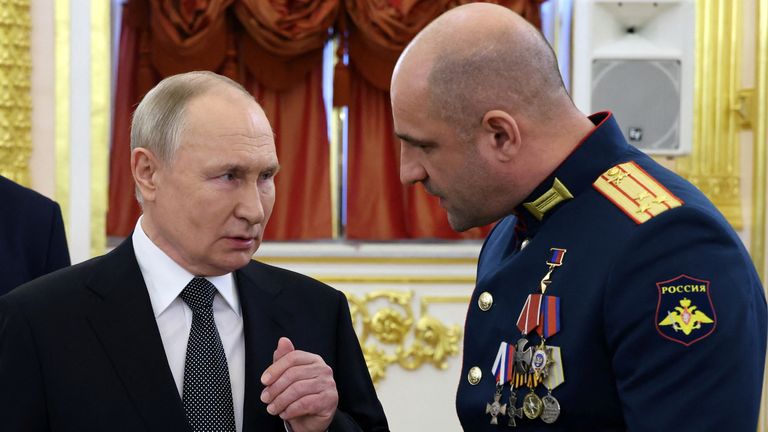 Russia's President Vladimir Putin speaks with Commander of the Sparta Battalion Artyom Zhoga during a ceremony to present Gold Star medals to service members, bearing the title of Hero of Russia and involved in the country's military campaign in Ukraine, on the eve of Heroes of the Fatherland Day in Moscow, Russia, December 8, 2023. Sputnik/Mikhail Klimentyev/Kremlin via REUTERS ATTENTION EDITORS - THIS IMAGE WAS PROVIDED BY A THIRD PARTY.