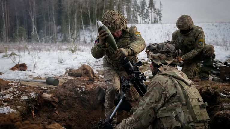 British soldiers attend the Winter Camp 23 military drills near Tapa, Estonia, Tuesday, Feb. 7, 2023. The Winter Camp exercises are regular drills conducted by NATO's multinational battle group in Estonia led by the United Kingdom. This year troops from Estonia, France, Denmark, and the UK are undergoing two-week exercises with armor, infantry, engineers, and artillery. (AP Photo/Sergei Grits)