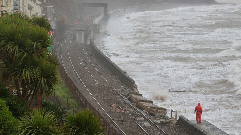 Rail emergency workers inspect damaged track along the seafront at Dawlish in south west England February 6, 2014. Storms destroyed sections of the mainline route to the south-west of England, and severe weather warnings for rain and gale force winds have been issued for the weekend. Pic: Reuters