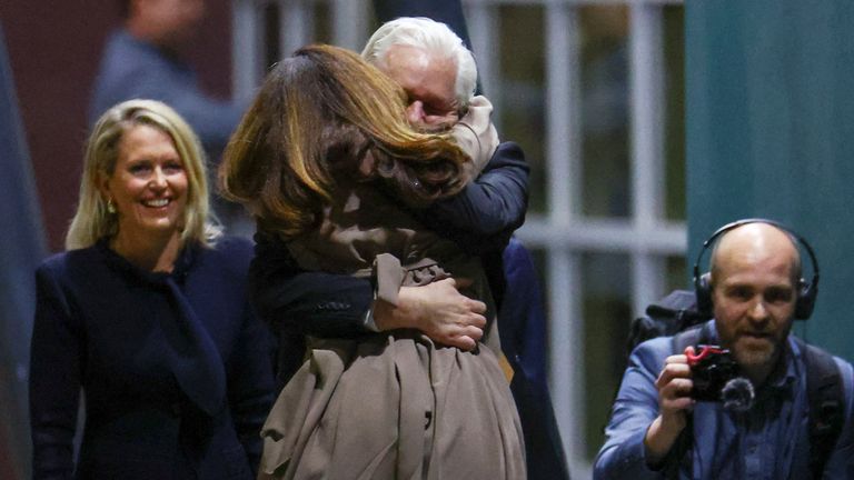 WikiLeaks founder Julian Assange embraces his wife Stella Assange as he arrives in Canberra, Australia, June 26, 2024. REUTERS/Edgar Su