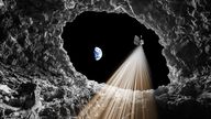 An artist's impression of the lunar pit in the Sea of Tranquillity on the Moon, an underground Moon cave that stretches tens of metres beneath an open pit and could be a potential lunar base for future astronauts
Pic: University of Trento/PA