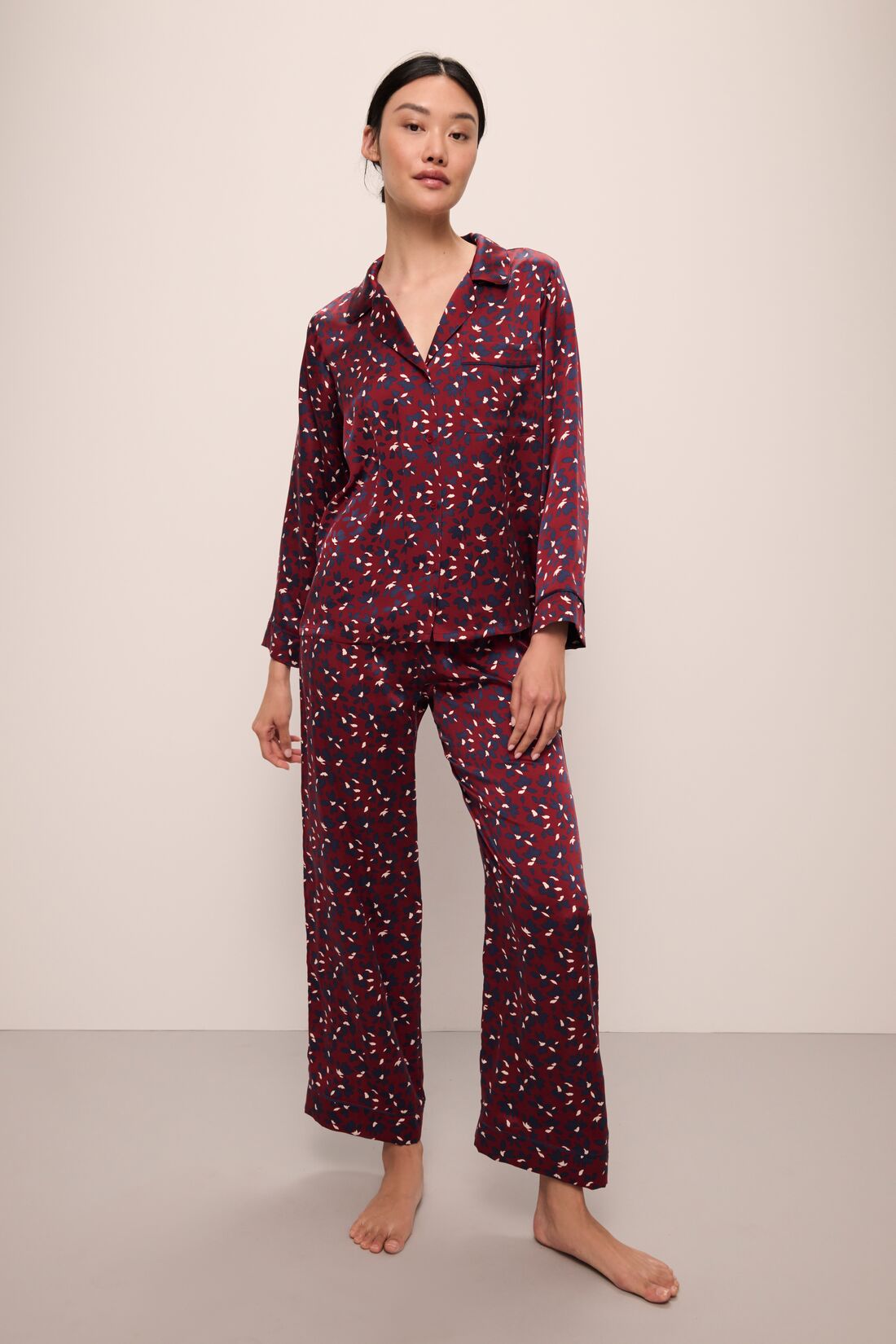 Model wears Inez Washable Silk Printed Long PJ Set in Winter Bloom Cabernet/Navy.