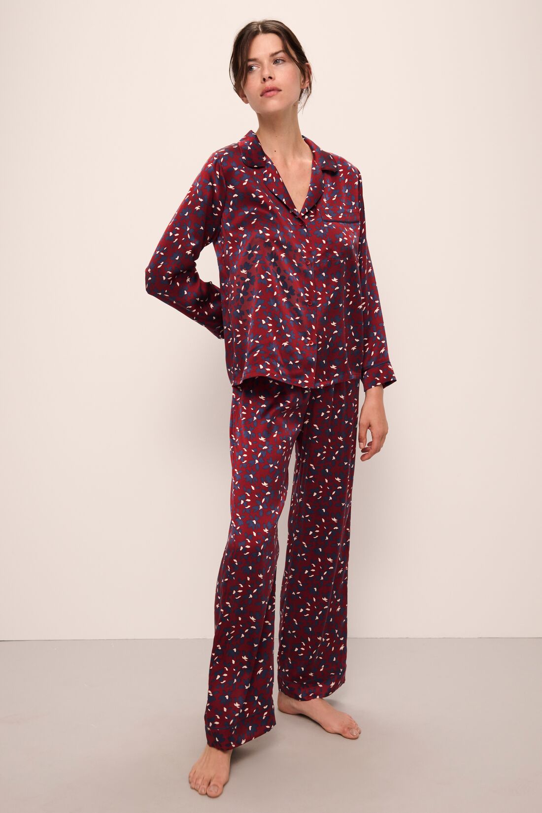 Model wears Inez Washable Silk Printed Long PJ Set in Winter Bloom Cabernet/Navy.