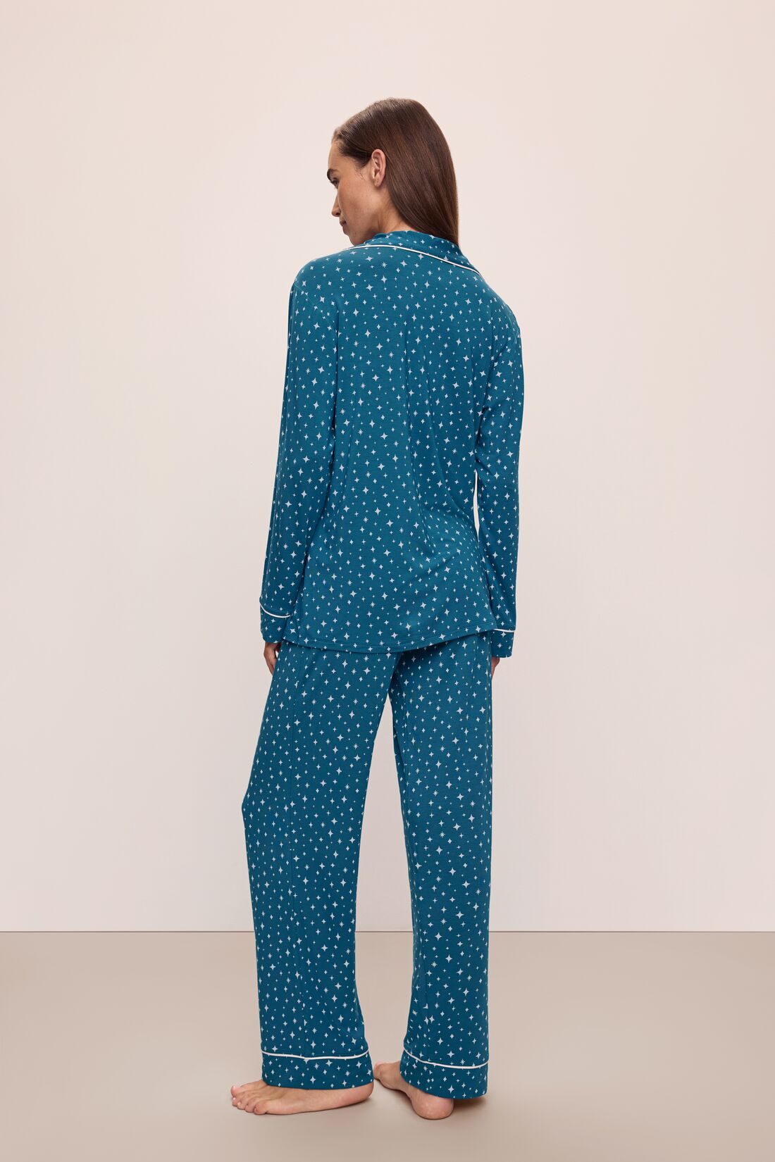 Model wears the Gisele Printed TENCEL™ Modal Long PJ Set in Festive Lights Sapphire/Ivory.