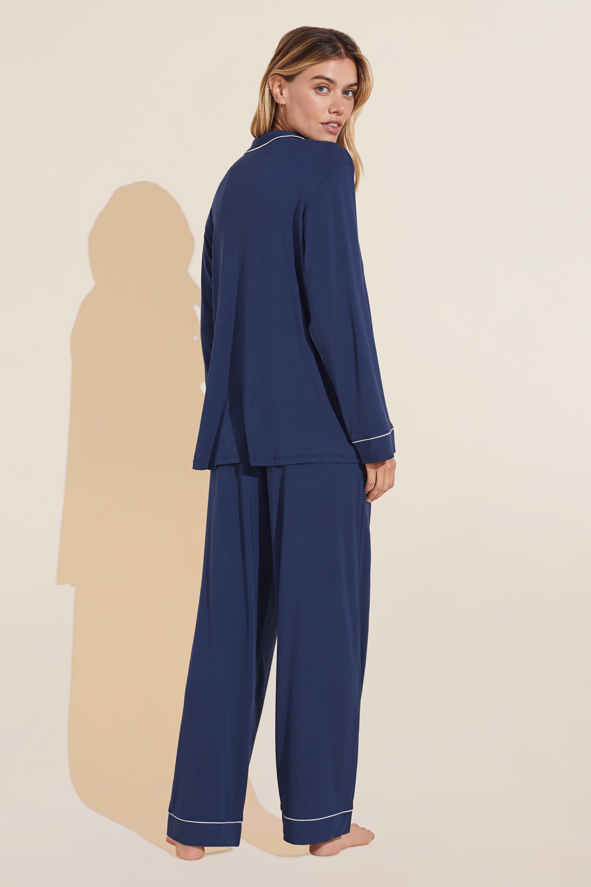 Model wears Gisele TENCEL™ Modal Long PJ Set in Navy/Ivory.