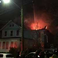 <p>Firefighters battled a two-alarm blaze that destroyed a Mount Vernon home displacing a dozen people overnight.</p>