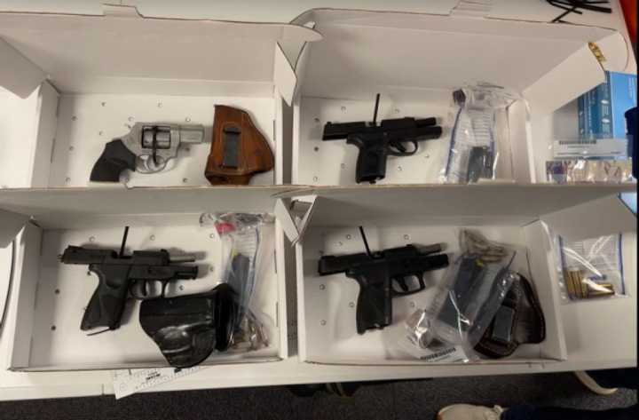 The four handguns recovered during the traffic stop.&nbsp;