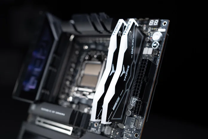 Two sticks of high-performance T-Force RAM installed in the NitroPath DRAM Technology slots on the ROG Crosshair X870E Hero motherboard