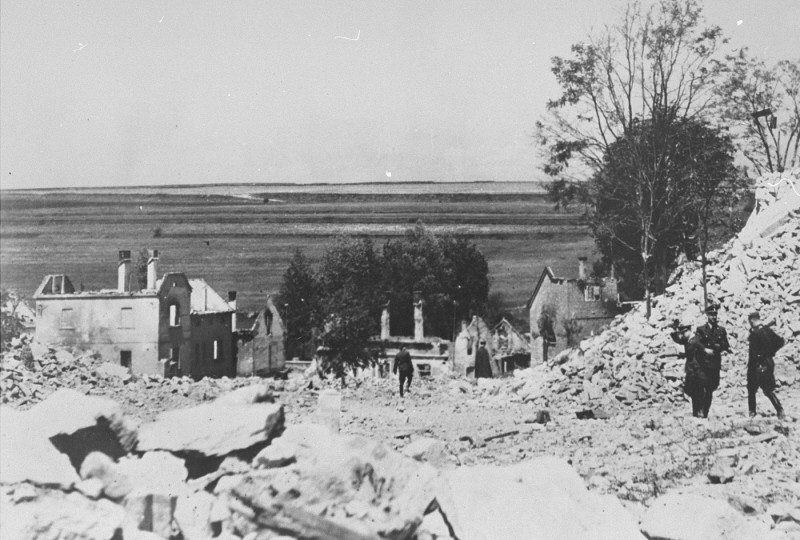 SS officers stand among the rubble of Lidice during the demolition of the town's ruins in reprisal for the assasination of Reinhard ...