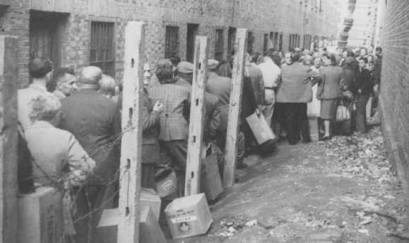 Jewish refugees line up to receive food provided by the American Jewish Joint Distribution Committee (JDC) after the war.