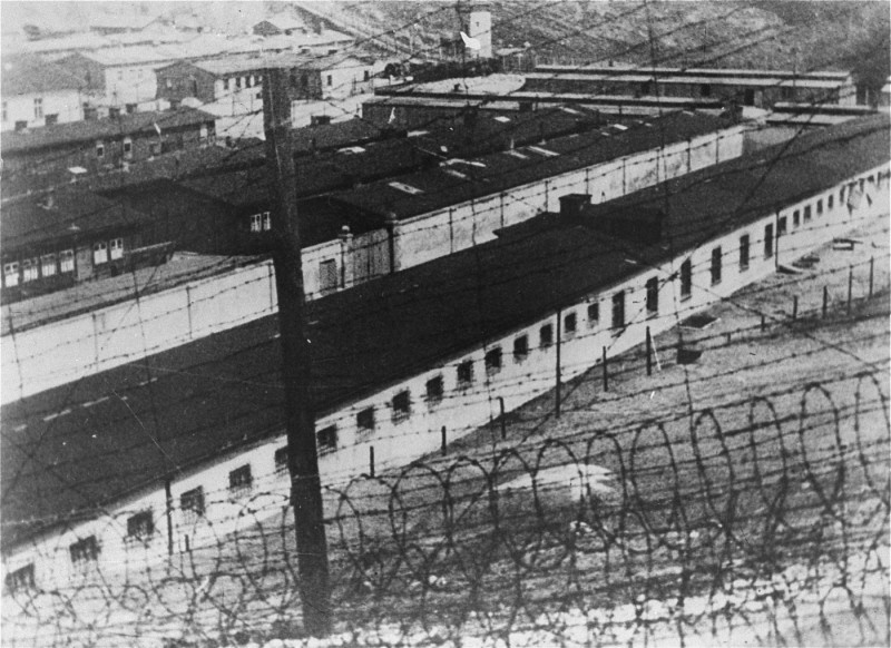 View, through the barbed wire, of the prisoner barracks in the Flossenbürg concentration camp.