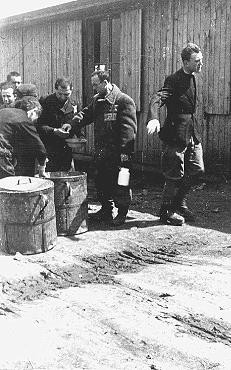 Prisoners receive meager food allocations at the Plaszow camp.