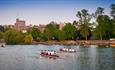 Rowers on the Thames with Windsor Castle in the background.