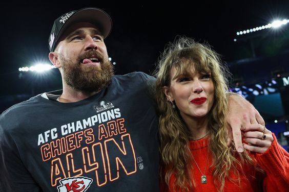 Travis Kelce #87 of the Kansas City Chiefs (L) celebrates with Taylor Swift after defeating the Baltimore Ravens in the AFC Championship Game at M&T Bank Stadium on January 28, 2024 in Baltimore, Maryland.