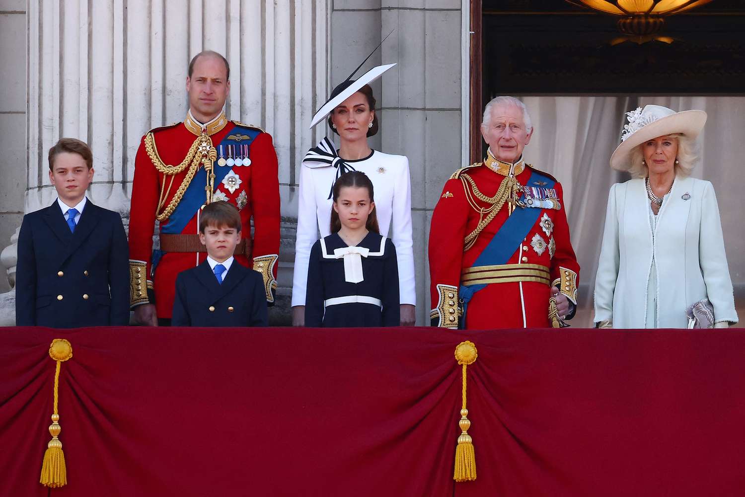 (L-R) Britain's Prince George of Wales, Britain's Prince William, Prince of Wales, Britain's Prince Louis of Wales, Britain's Catherine, Princess of Wales, Britain's Princess Charlotte of Wales, Britain's King Charles III and Britain's Queen Camilla stand on the balcony of Buckingham Palace after attending the King's Birthday Parade "Trooping the Colour" in London on June 15, 2024. The ceremony of Trooping the Colour is believed to have first been performed during the reign of King Charles II. Since 1748, the Trooping of the Colour has marked the official birthday of the British Sovereign. Over 1500 parading soldiers and almost 300 horses take part in the event.