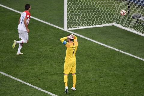 France's goalkeeper Hugo Lloris reacts after Croatia's forward Mario Mandzukic (L) scored during the Russia 2018 World Cup final football match between France and Croatia at the Luzhniki Stadium in Moscow on July 15, 2018. / AFP PHOTO / GABRIEL BOUYS / RESTRICTED TO EDITORIAL USE - NO MOBILE PUSH ALERTS/DOWNLOADS