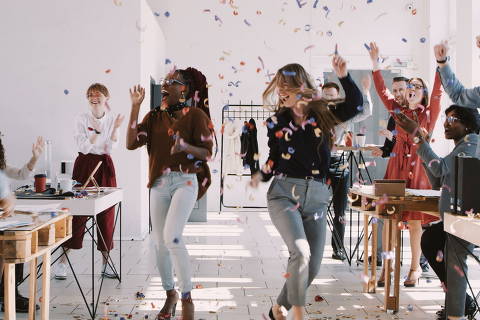 RED EPIC-W Happy young multiethnic female colleagues celebrate success with team and confetti at office slow motion. Young silly excited business women dancing at fun healthy workplace party. - (Photo: vadim_key/Adobe Stock)