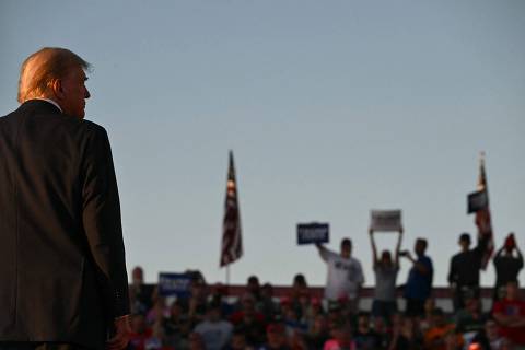 Former US President and Republican presidential candidate Donald Trump looks on during a campaign rally at site of his first assassination attempt in Butler, Pennsylvania on October 5, 2024. (Photo by Jim WATSON / AFP)