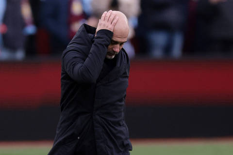 Soccer Football - Premier League - Aston Villa v Manchester City - Villa Park, Birmingham, Britain - December 21, 2024 Manchester City manager Pep Guardiola looks dejected after the match REUTERS/Hannah Mckay EDITORIAL USE ONLY. NO USE WITH UNAUTHORIZED AUDIO, VIDEO, DATA, FIXTURE LISTS, CLUB/LEAGUE LOGOS OR 'LIVE' SERVICES. ONLINE IN-MATCH USE LIMITED TO 120 IMAGES, NO VIDEO EMULATION. NO USE IN BETTING, GAMES OR SINGLE CLUB/LEAGUE/PLAYER PUBLICATIONS. PLEASE CONTACT YOUR ACCOUNT REPRESENTATIVE FOR FURTHER DETAILS..