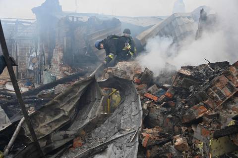 Rescuers of the State Emergency Service work to put out a fire in a private house after a drone strike in Kharkiv, on December 25, 2024, amid the Russian invasion in Ukraine. The Ukrainian president on December 25 denounced an 