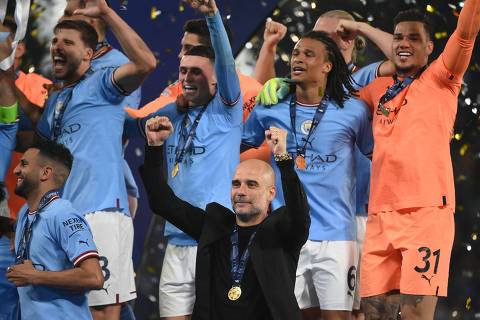 Manchester City's Spanish manager Pep Guardiola celebrates with his winners' medal after the UEFA Champions League final football match between Inter Milan and Manchester City at the Ataturk Olympic Stadium in Istanbul, on June 10, 2023. (Photo by FRANCK FIFE / AFP)