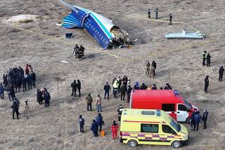 PhotoFlash | Azerbaijan Airlines plane from Baku crashes near Kazakhstan's Aktau