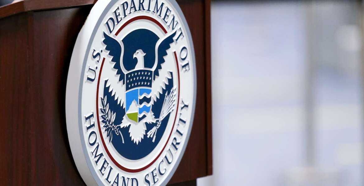 FILE - In this Nov. 20, 2020, file photo a U.S. Department of Homeland Security plaque is displayed a podium as international passengers arrive at Miami international Airport where they are screened by U.S. Customs and Border Protection in Miami. The damned-if-you-pay-damned-if-you-don’t dilemma on ransomware payments has left U.S. officials fumbling about how to respond. While the Biden administration “strongly discourages” paying, it recognizes that failing to pay would be suicidal for some victims. (AP Photo/Lynne Sladky, File)