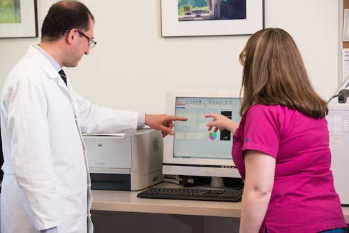 Doctor and nurse looking at computer