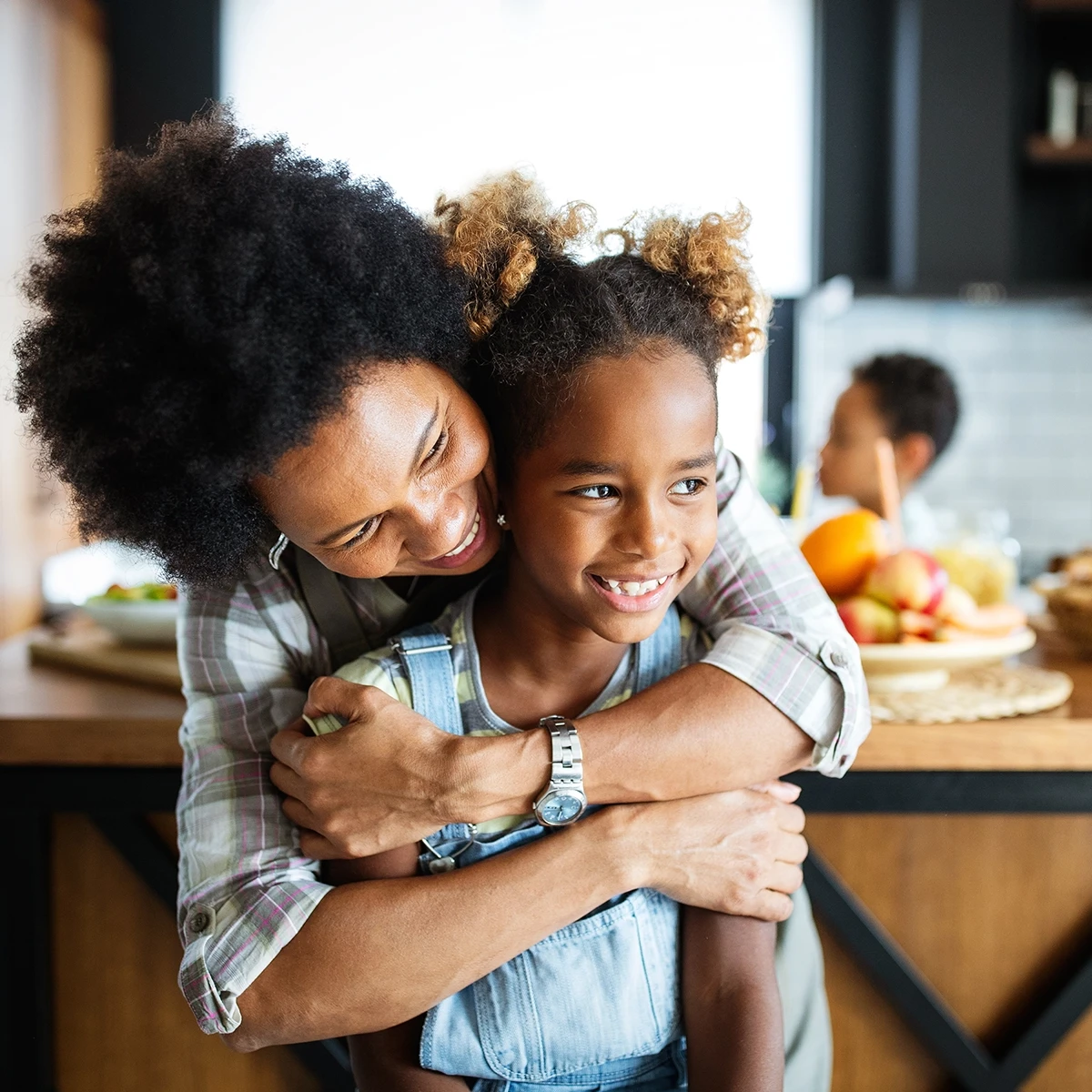 woman and daughter embracing