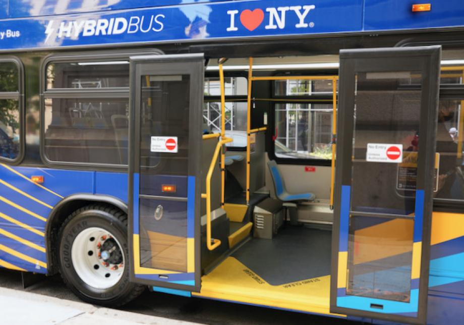 back doors of bus opened out vertically along the sides of the bus.