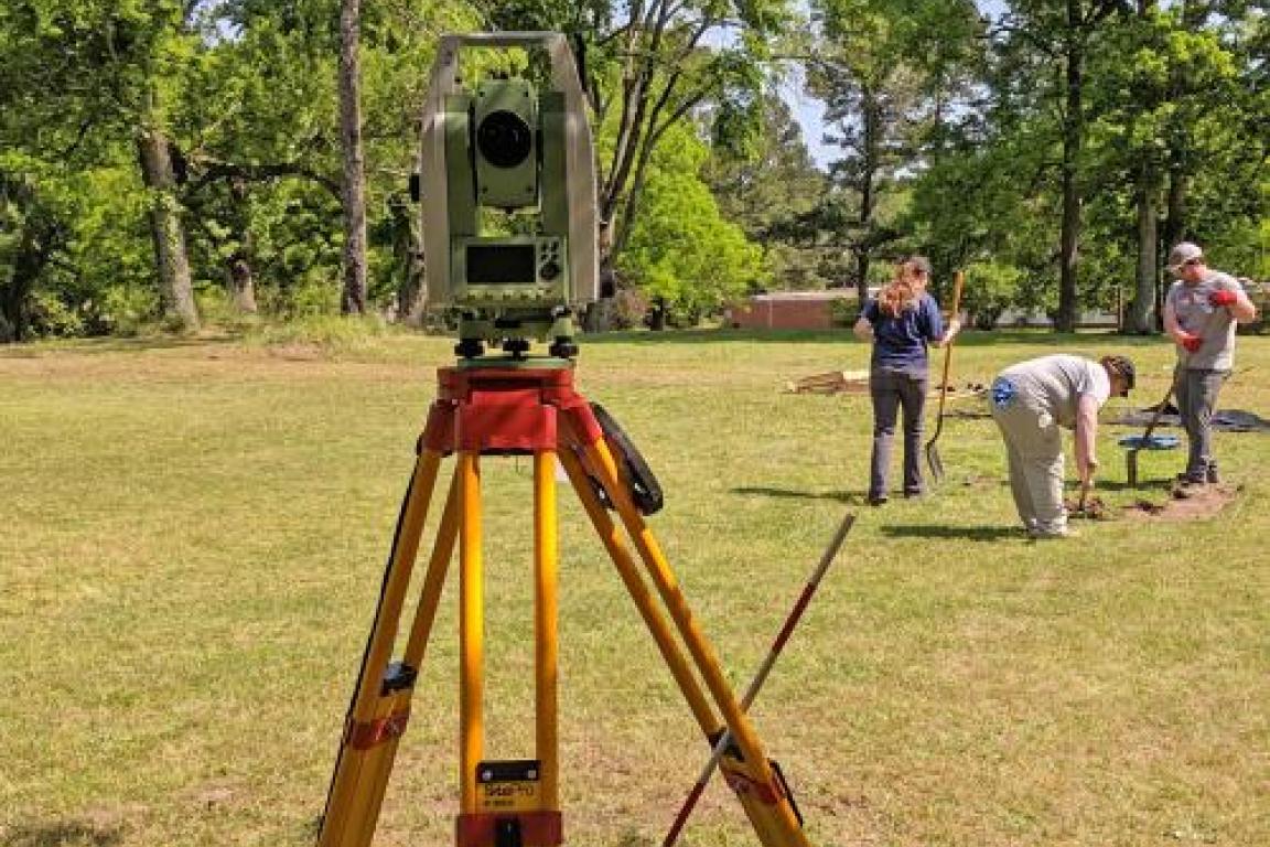 Total station and archaeologists