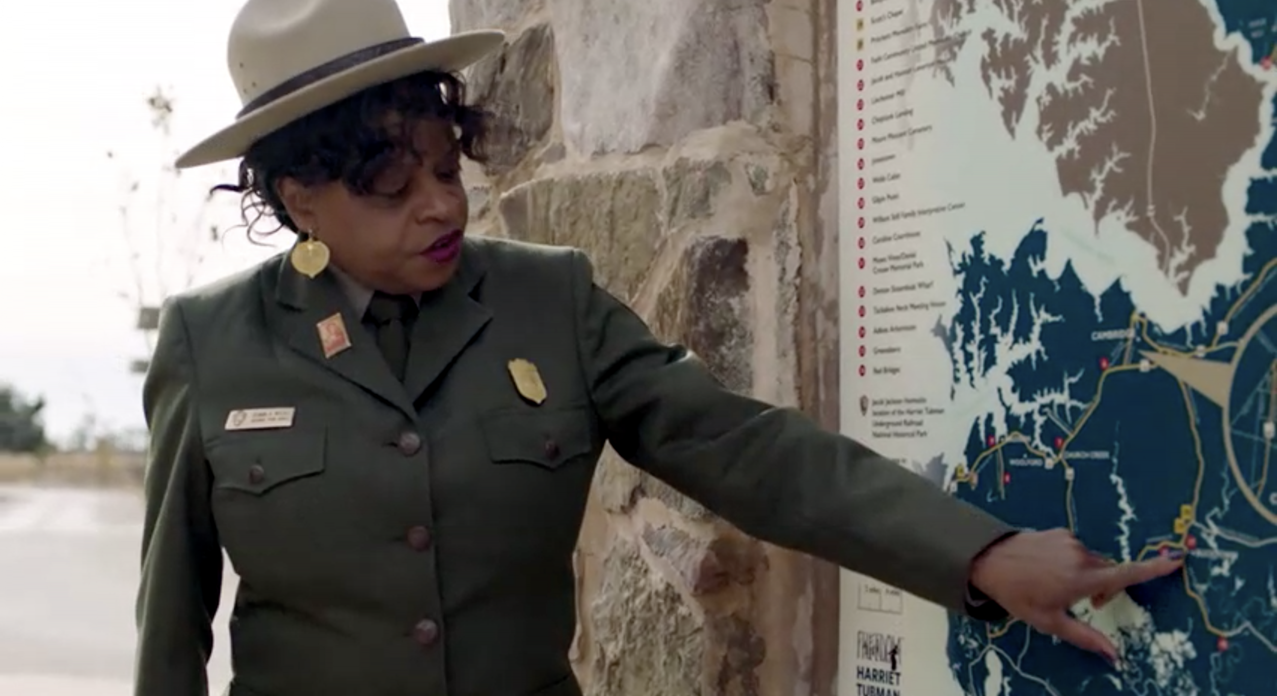 A National Park Service Employee points to a spot on a map