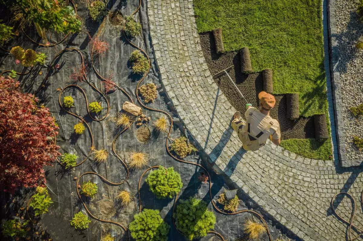 Overhead view of landscaper working on garden