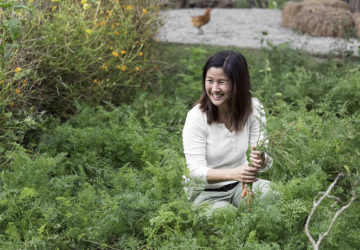 Melanie Go showcasing a portion of the vegetable patches at Holy Carabao Farm