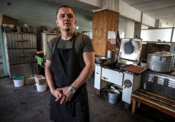 Serhiy, 30, a former restaurant chef and military cook stands as he prepares a meal, amid Russia's attack on Ukraine, in Dnipropetrovsk region