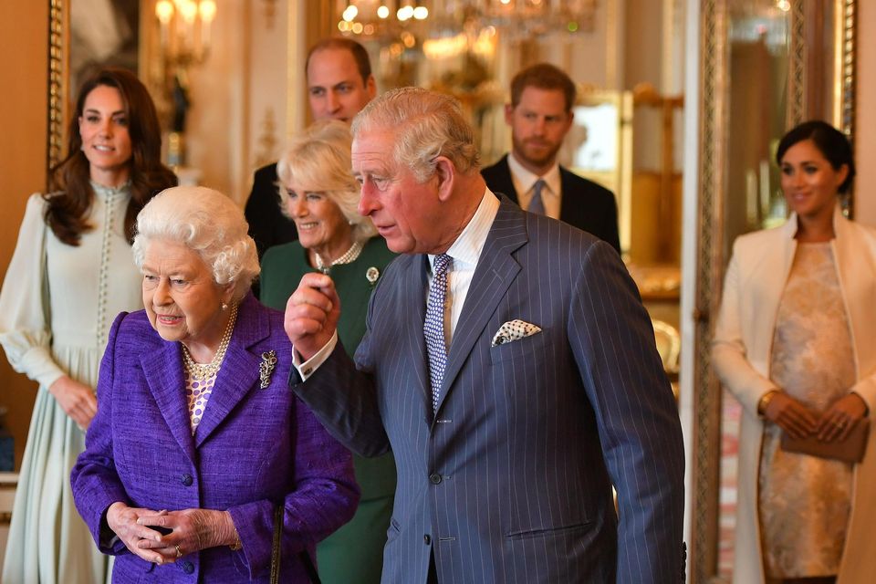 Queen Elizabeth II is joined by the Prince of Wales, and (rear, left to right) the Duchess of Cambridge, the Duchess of Cornwall, the Duke of Cambridge and the Duke and Duchess of Sussex at a reception at Buckingham Palace in London to mark the fiftieth anniversary of the investiture of the Prince of Wales