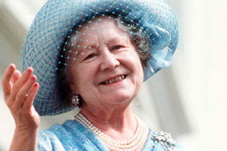 The Queen Mother waving from the balcony of her home, Clarence House: Photo by Tim Graham/Getty Images