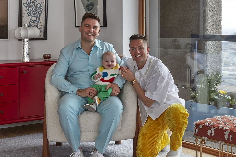 Bryan O'Sullivan, left, with his husband, James O'Neill, and their son, Cosmo. Photo: James McDonald