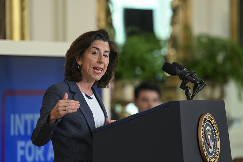 U.S. Secretary of Commerce Gina Raimondo speaks at a podium with the presidential seal at the White House