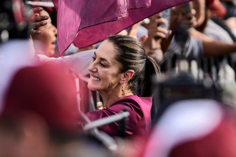 Claudia Sheinbaum greets supporters during her presidential campaign launch event in Mexico City.