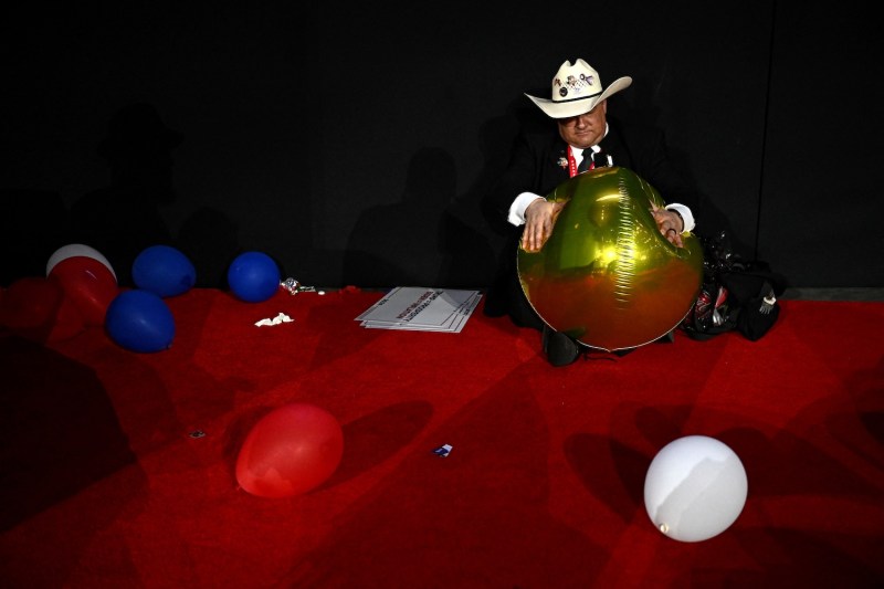 An attendee holds a balloon at the end of the last day of the 2024 Republican National Convention in Milwaukee, Wisconsin, on July 18.