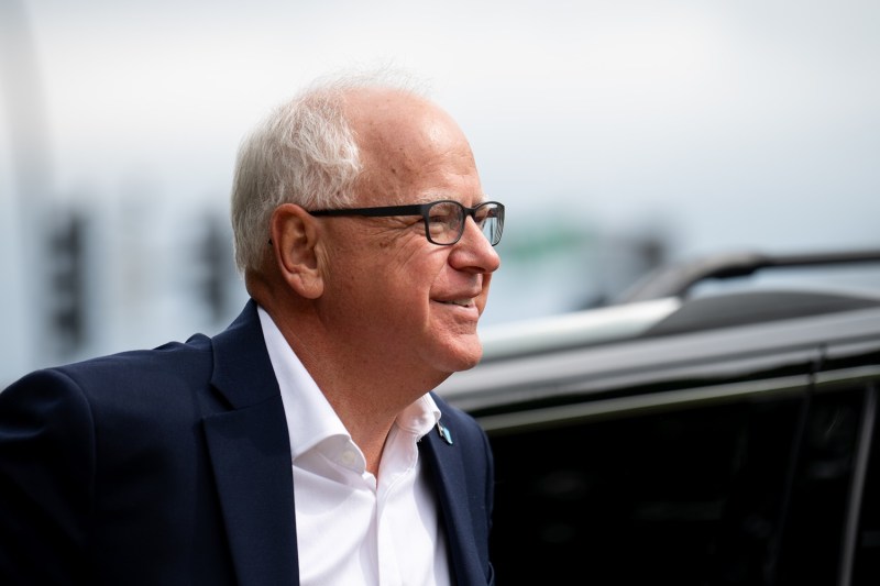 Minnesota Gov. Tim Walz arrives to speak at a press conference regarding new gun legislation at City Hall in Bloomington, Minn.