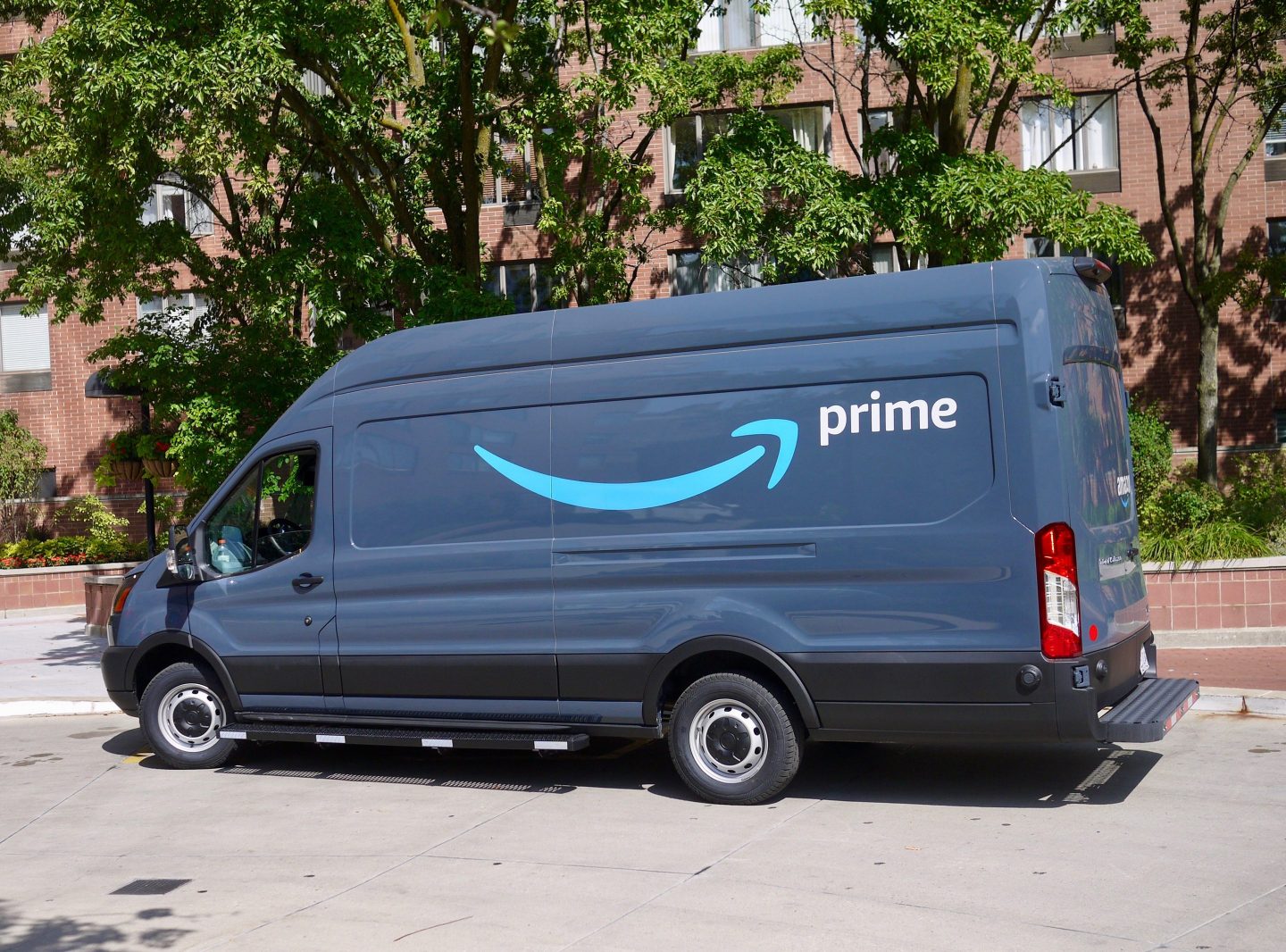 View of an Amazon delivery van with an Amazon Prime logo parked at an apartment complex in downtown Chicago, Illinois, April 2019. (Photo by Interim Archives/Getty Images)