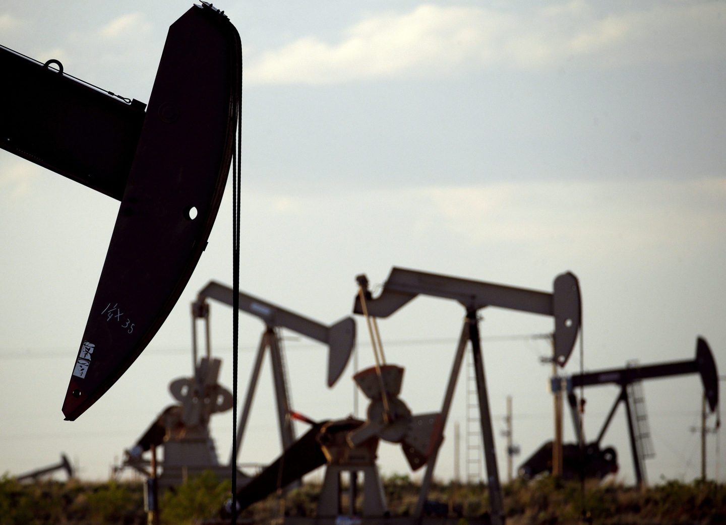 FILE &#8211; Pump jacks work in a field near Lovington, N.M., April 24, 2015. New Mexico oilfield and air quality regulators on Thursday, June 29, 2023, announced unprecedented state fines against a Texas-based oil and natural gas producer on accusations that the company flouted local pollution reporting and control requirements by burning off vast amounts of natural gas in a prolific energy-production zone in the southeast of the state. (AP Photo/Charlie Riedel, File)