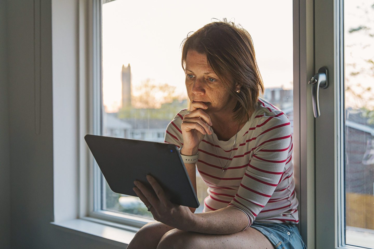 Woman working at a digital tablet